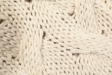 Photo of Texture of cozy warm sweater as background, closeup