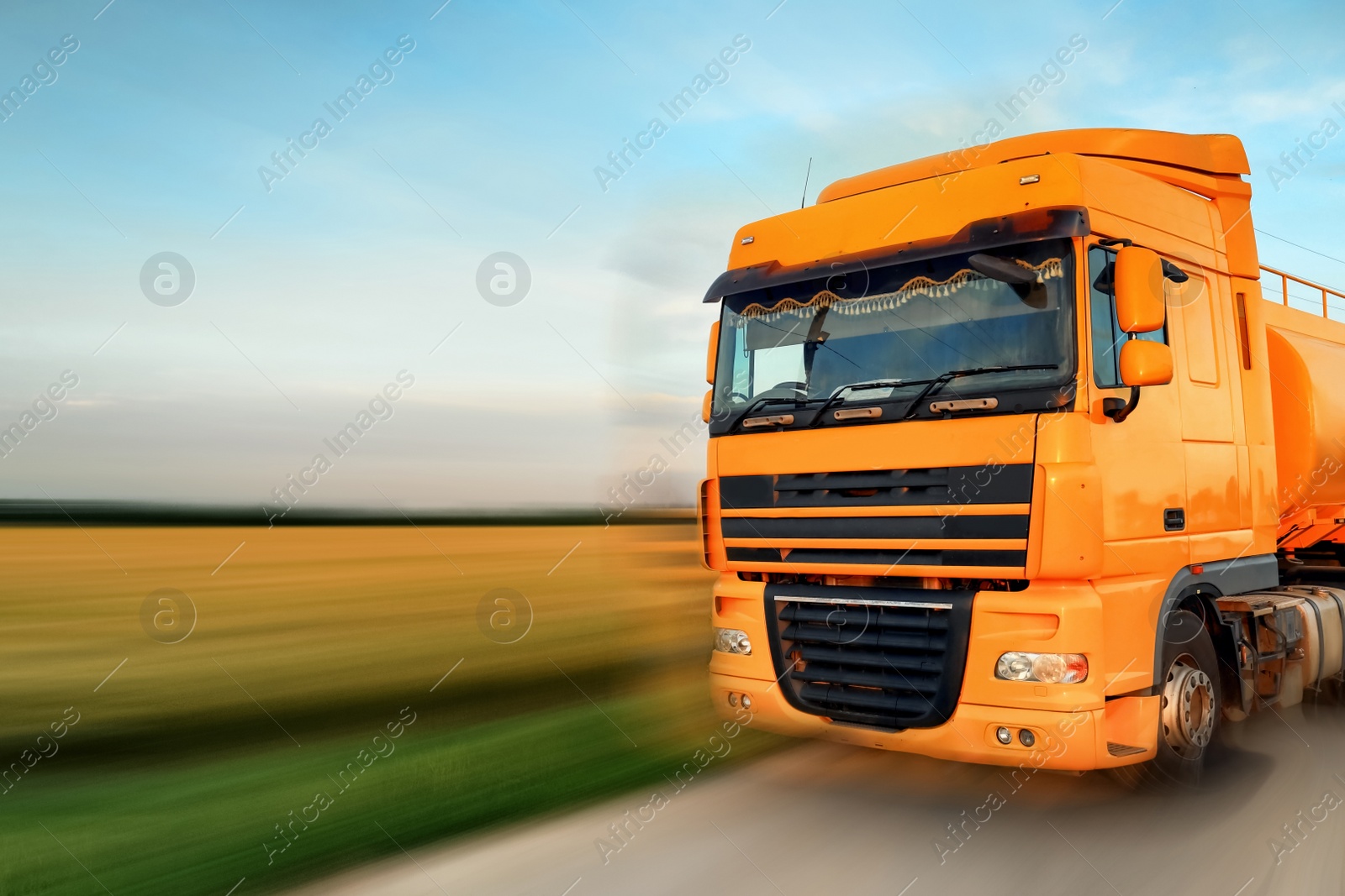 Image of Logistics concept. Truck on country road, motion blur effect 