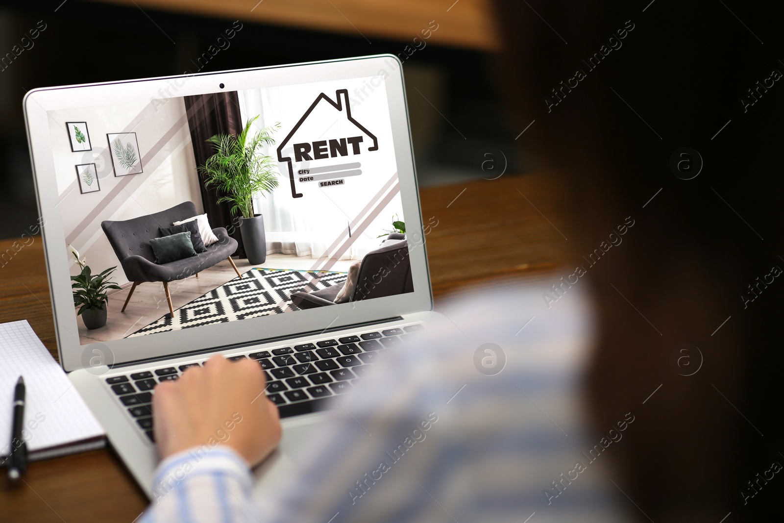 Image of Woman searching for apartment on rental property website via laptop, closeup