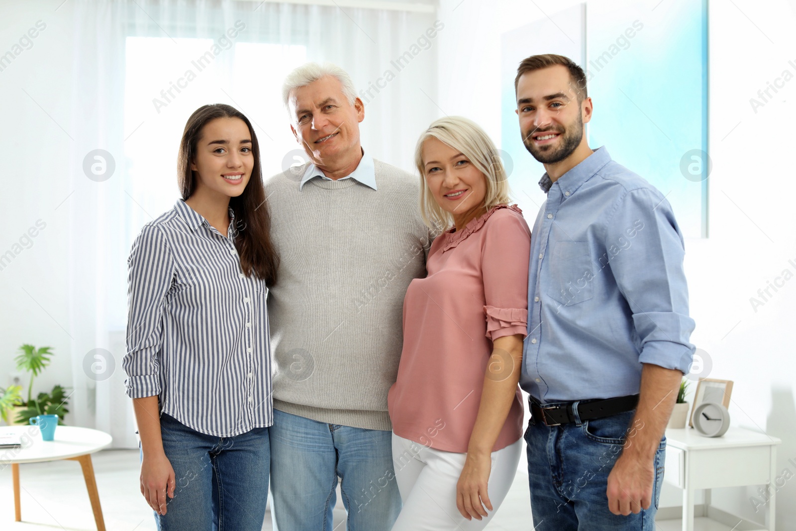 Photo of Portrait of happy family at home. Reunion of generations