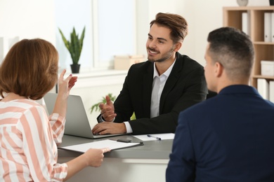 Human resources manager conducting job interview with applicants in office