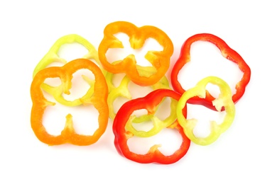 Rings of ripe bell peppers on white background, top view