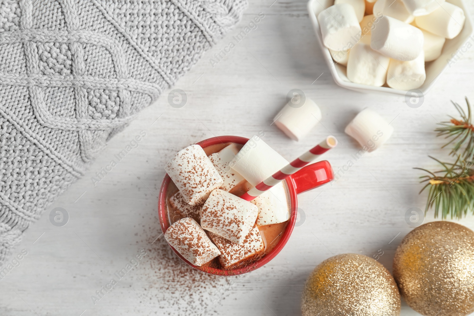 Photo of Flat lay composition with hot cocoa drink and marshmallows on wooden background