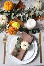 Photo of Beautiful autumn table setting. Plates, cutlery, glasses and floral decor, flat lay