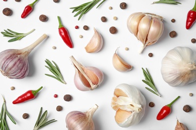 Photo of Composition with garlic, rosemary and peppers on white background, top view