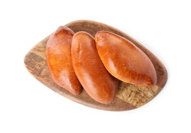 Wooden board with delicious baked patties on white background