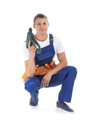 Electrician with drill wearing uniform on white background