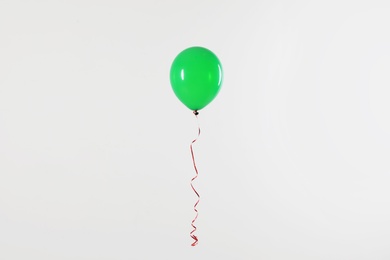 Bright balloon on light background. Celebration time