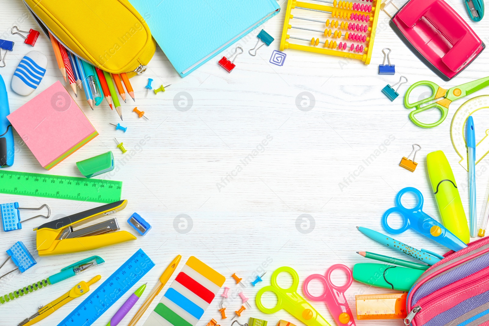 Photo of Flat lay composition with different school stationery on wooden background