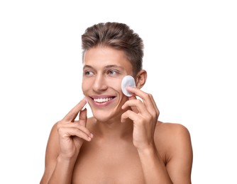 Handsome man with cotton pads on white background