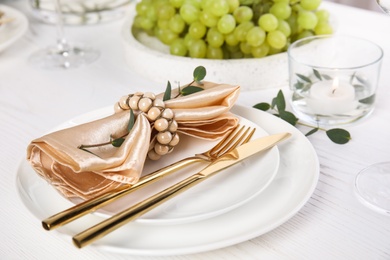 Elegant festive table setting on white wooden table