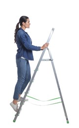 Photo of Young woman climbing up metal ladder on white background