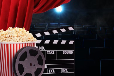 Image of Tasty popcorn, film reel and clapperboard under red main curtain in cinema, space for text