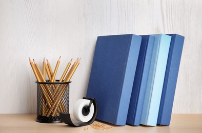 Photo of Different stationery on wooden table. Back to school