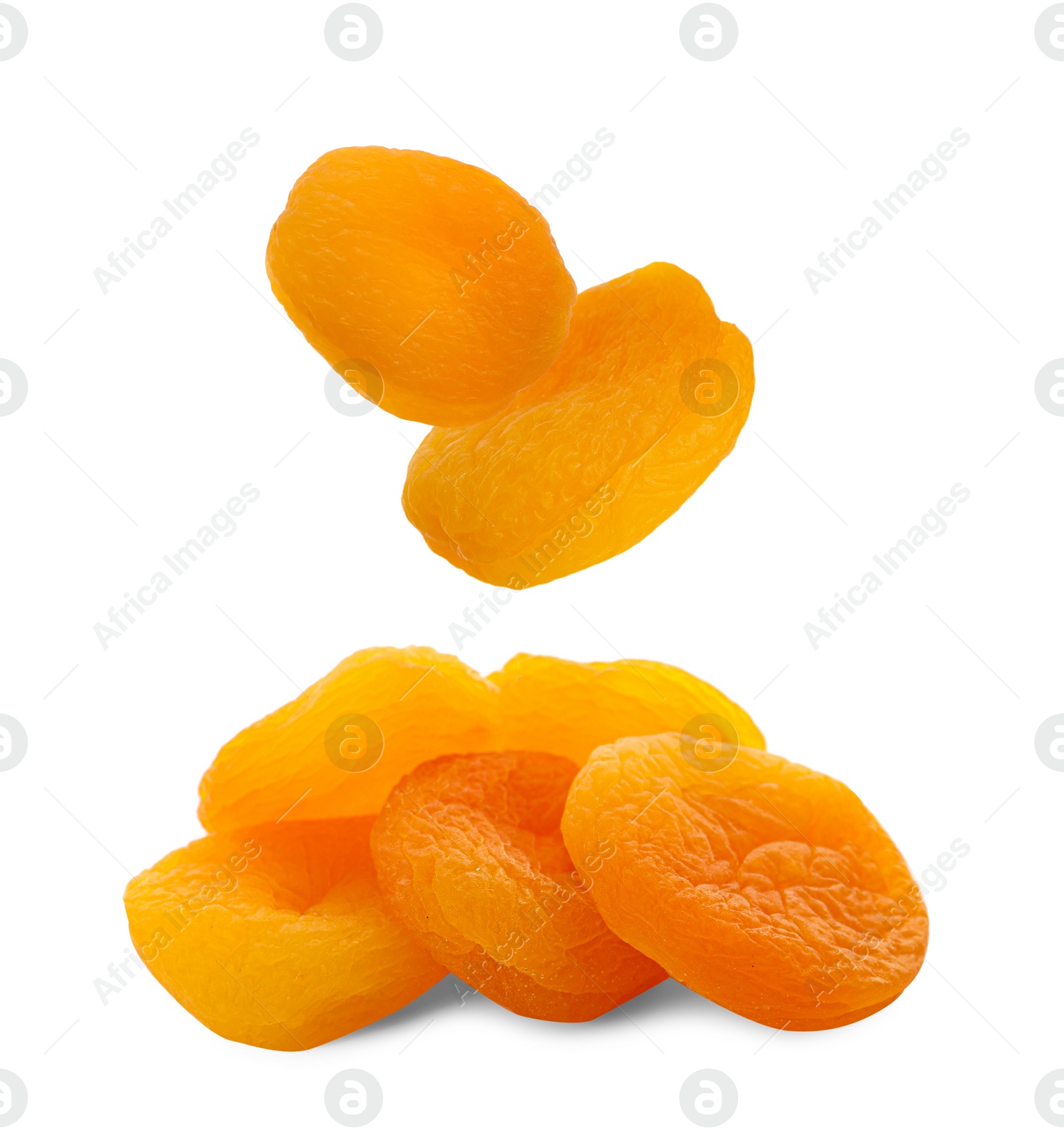 Image of Tasty dried apricots falling on white background