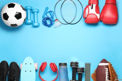 Photo of Different sports equipment on light blue background, flat lay. Space for text