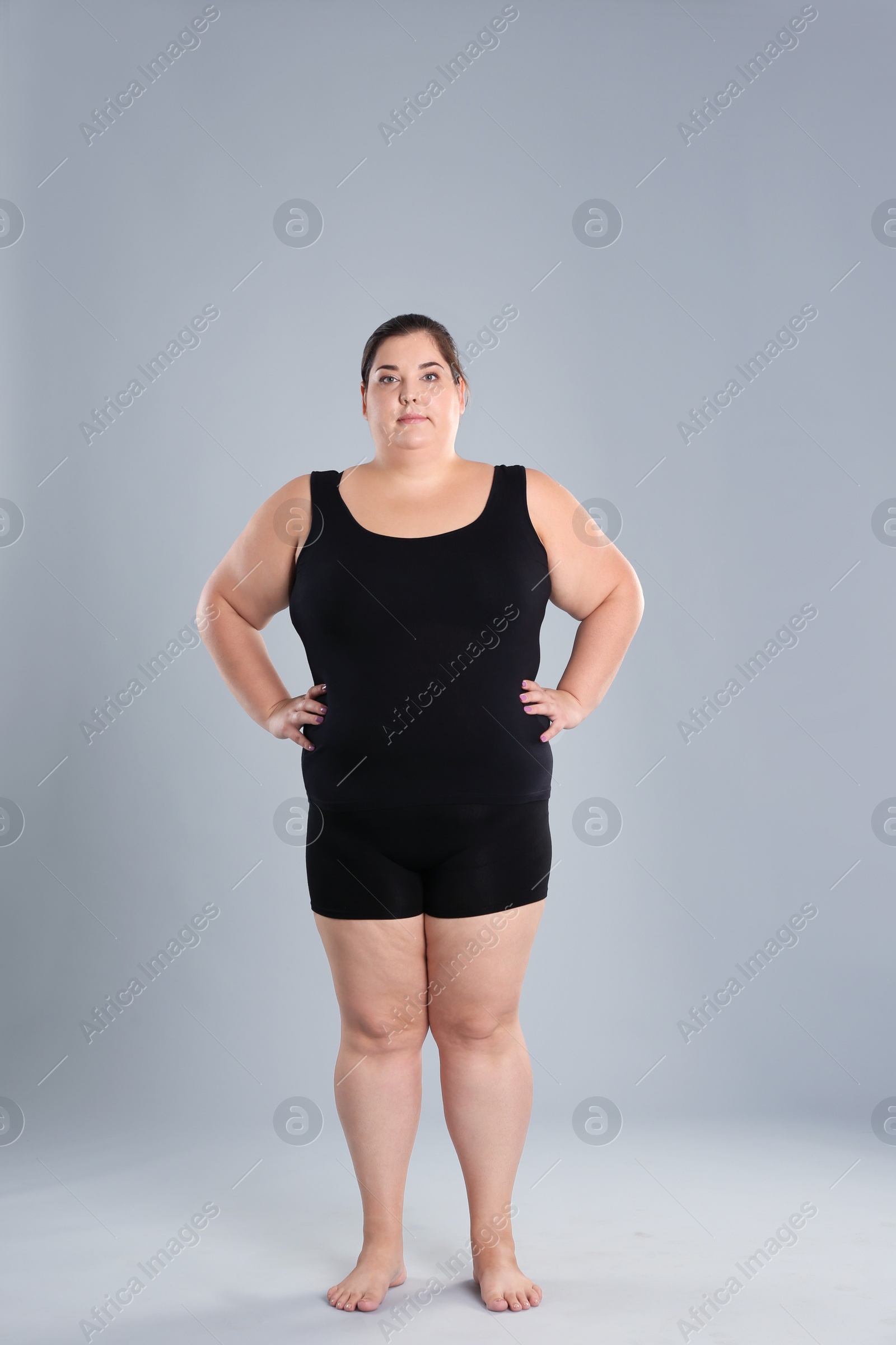 Photo of Overweight woman before weight loss on color background