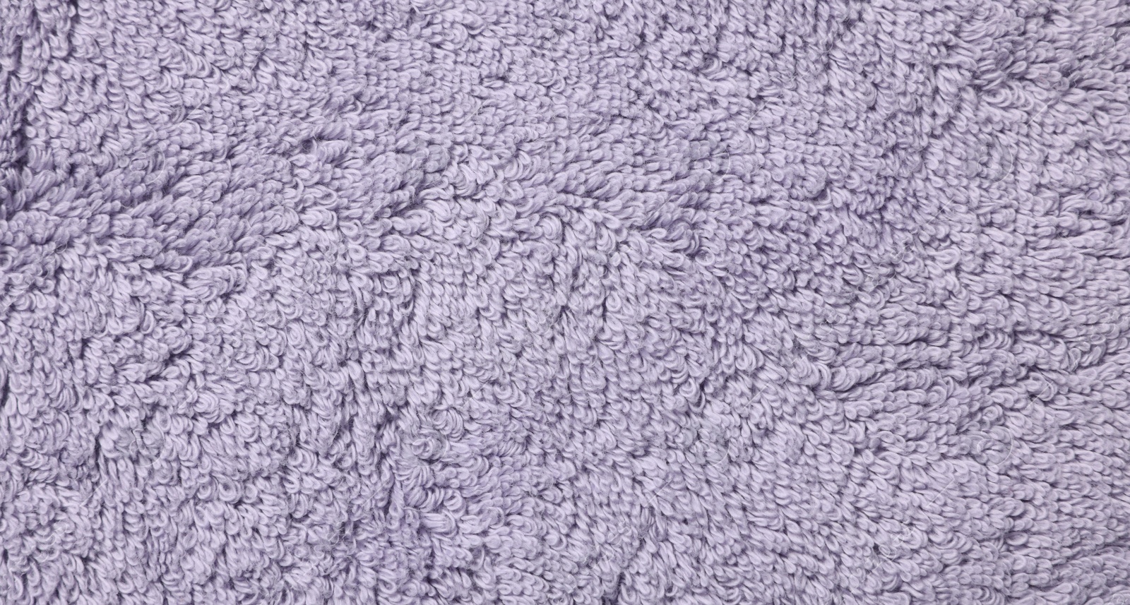 Photo of Texture of soft violet fabric as background, top view