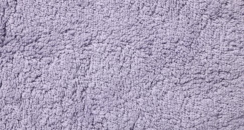 Photo of Texture of soft violet fabric as background, top view