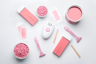 Set of epilation products on light background, flat lay