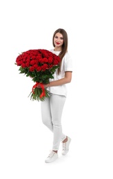 Full length portrait of beautiful woman with bouquet of roses on white background