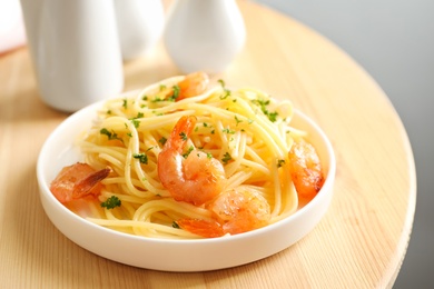 Delicious pasta with shrimps on plate