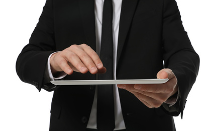 Businessman using tablet computer on white background, closeup