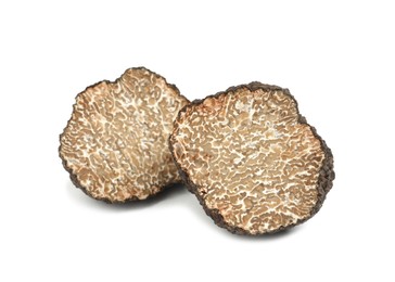 Photo of Cut fresh black truffle isolated on white