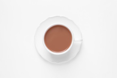 Photo of Delicious tea with milk in cup on white background, top view