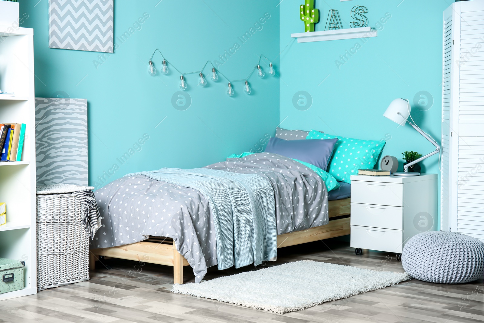 Photo of Comfortable bed in modern children room