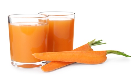 Photo of Freshly made carrot juice on white background