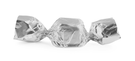 Photo of Tasty candy in silver wrapper isolated on white