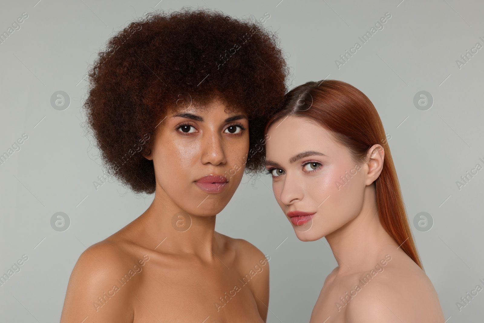 Photo of Portrait of beautiful young women on light grey background