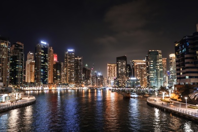 Photo of DUBAI, UNITED ARAB EMIRATES - NOVEMBER 03, 2018: Night cityscape of marina district with illuminated buildings