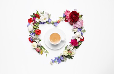 Photo of Beautiful heart made of different flowers and coffee  on white background, top view