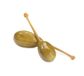 Photo of Two delicious pickled capers on white background