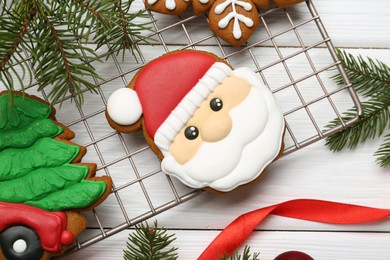 Tasty homemade Christmas cookies and decor on white wooden table, flat lay