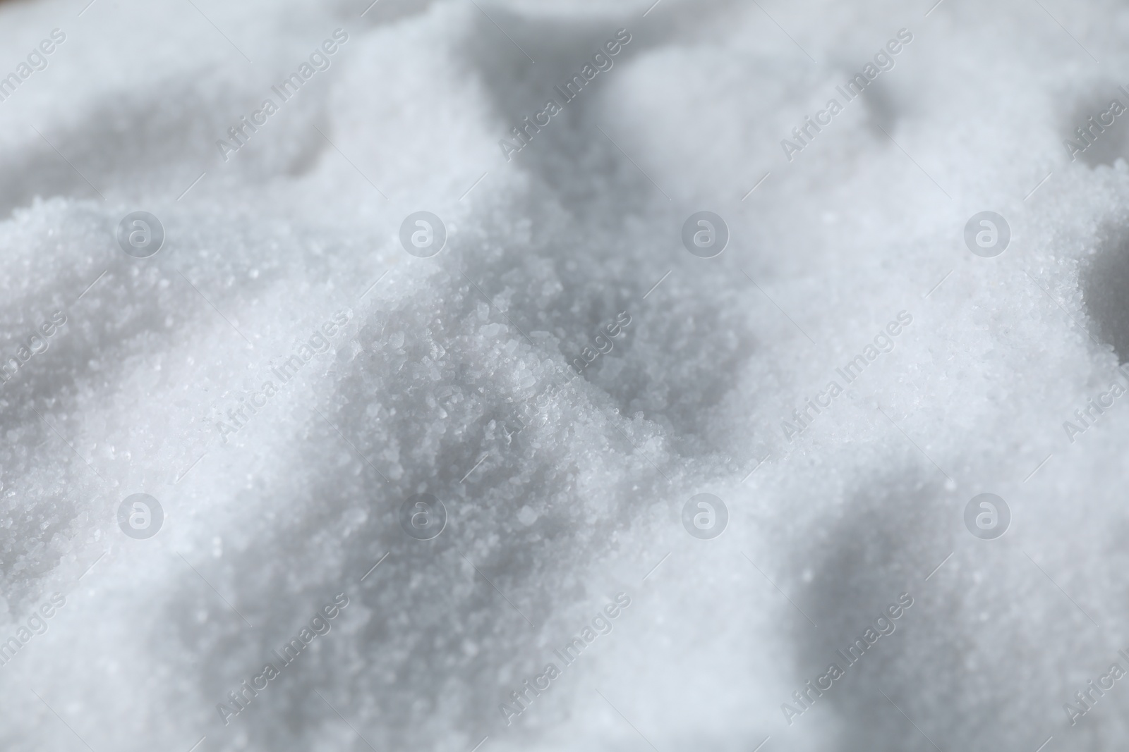 Photo of Organic white sea salt as background, closeup