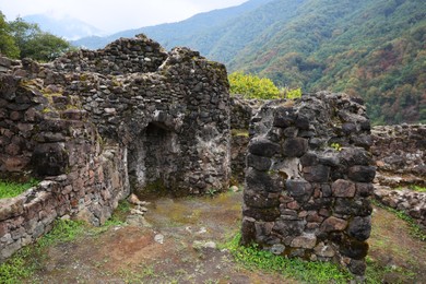 Photo of View on stone ruins and forest in mountains