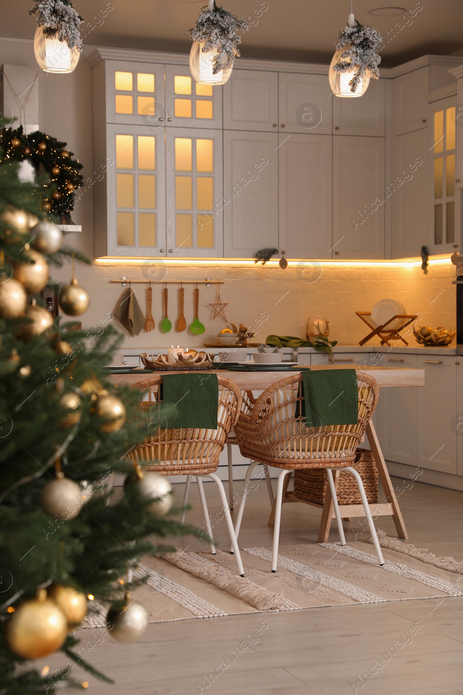 Photo of Cozy spacious kitchen decorated for Christmas. Interior design