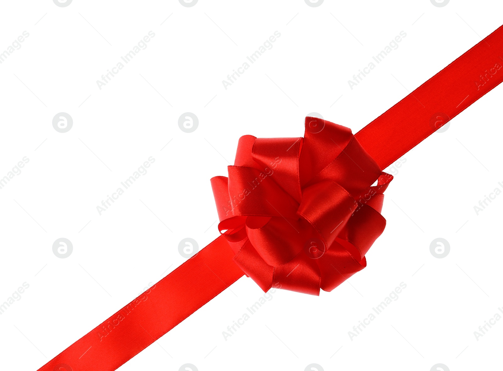 Photo of Red ribbon with bow on white background. Festive decoration