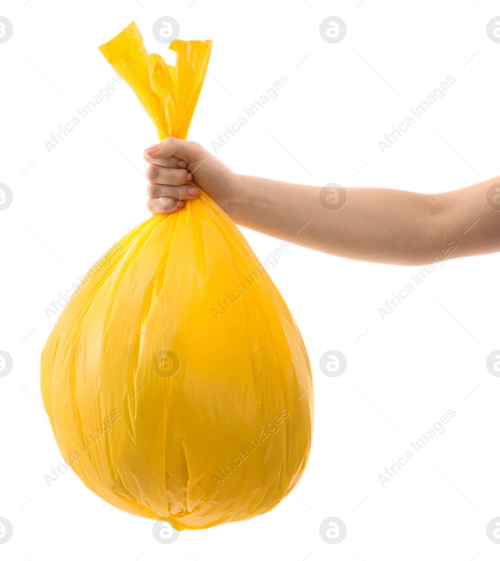 Photo of Woman holding plastic bag full of garbage on white background, closeup