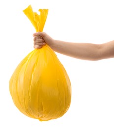 Photo of Woman holding plastic bag full of garbage on white background, closeup