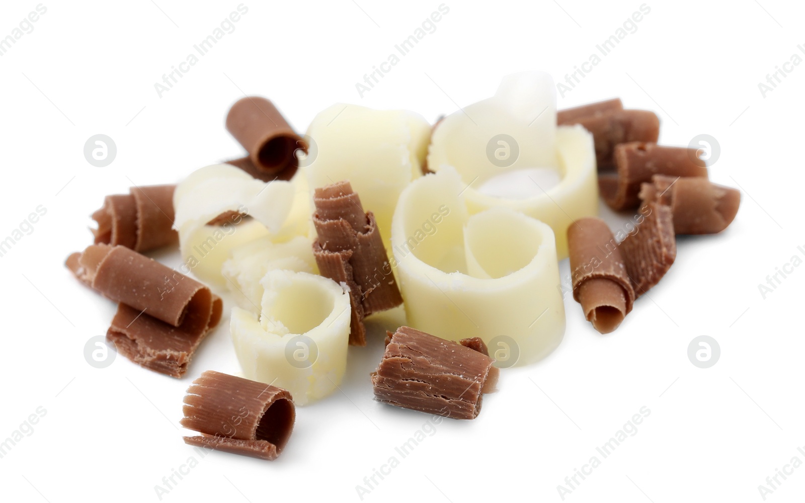 Photo of Pile of different tasty chocolate shavings isolated on white