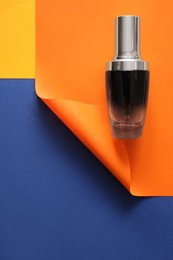 Blank bottle of perfume on color background. Space for text