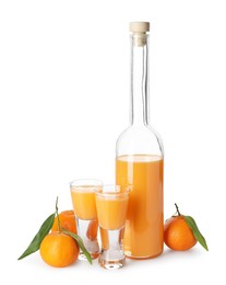 Photo of Tasty tangerine liqueur and fresh fruits isolated on white