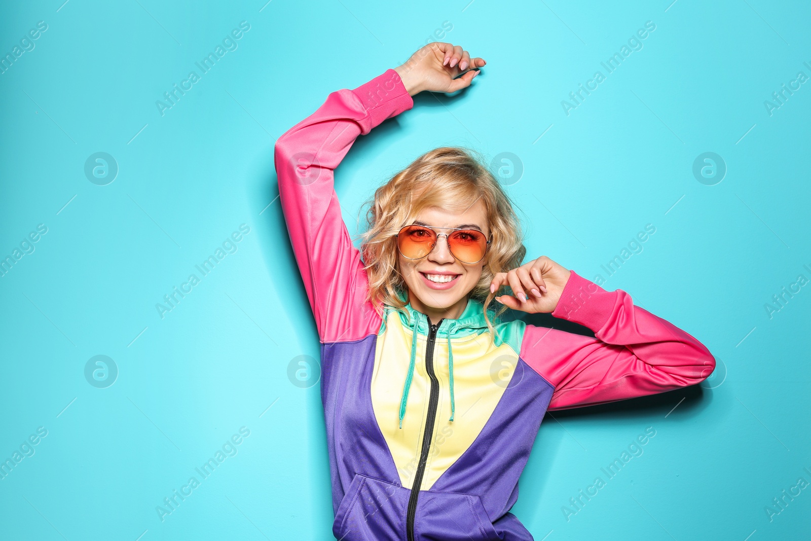 Photo of Stylish young woman posing on color background