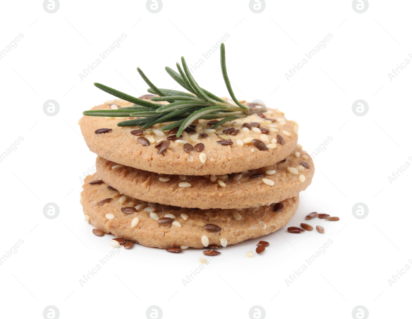 Photo of Stack of round cereal crackers with flax, sunflower, sesame seeds and rosemary isolated on white