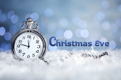 Image of Happy Christmas Eve, postcard design. Pocket watch on snow against blurred lights 