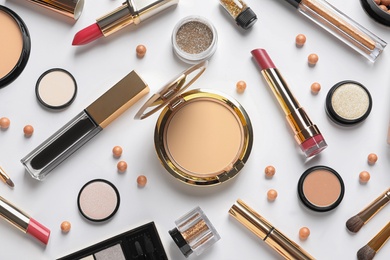 Photo of Different luxury makeup products on white background, top view